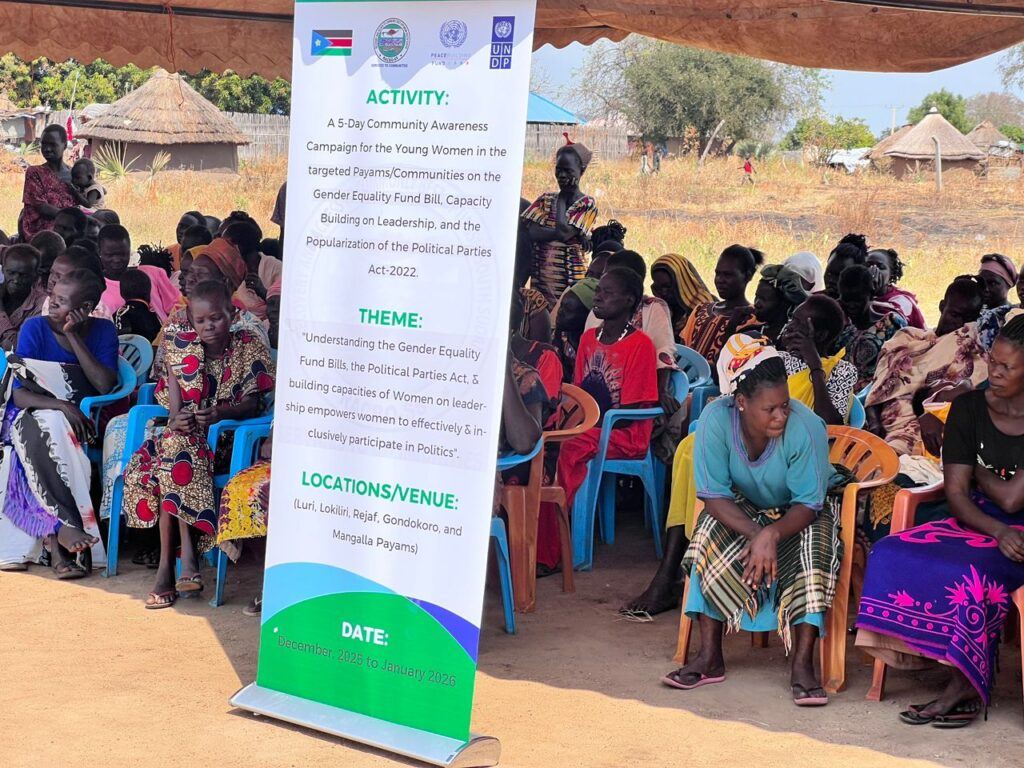 Active participants during the activity, and the photo shows a section of the village behind the participants.